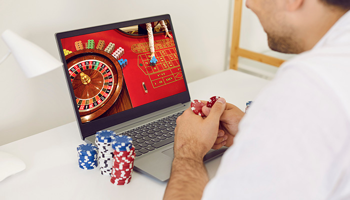 Gambler Playing Roulette on Mobile Device