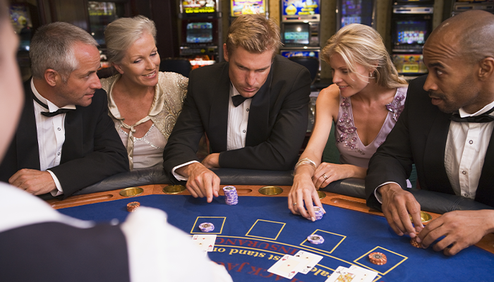 People Sitting at Blackjack Table