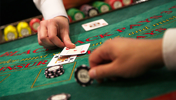 Gambler Playing Blackjack in Casino