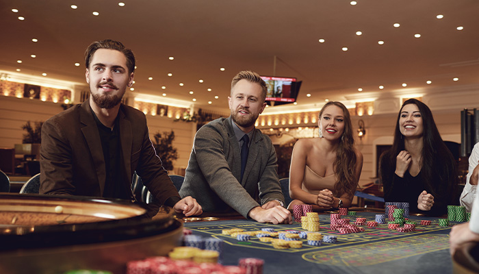 Gamblers Playing Roulette in Casino