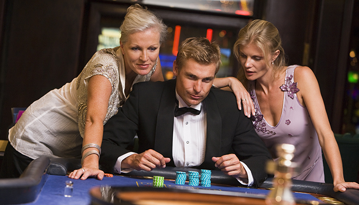 Gamblers Playing Roulette in Casino