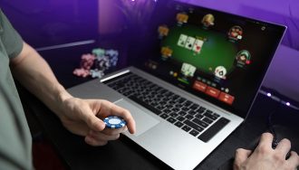 Person Playing Poker on a Computer