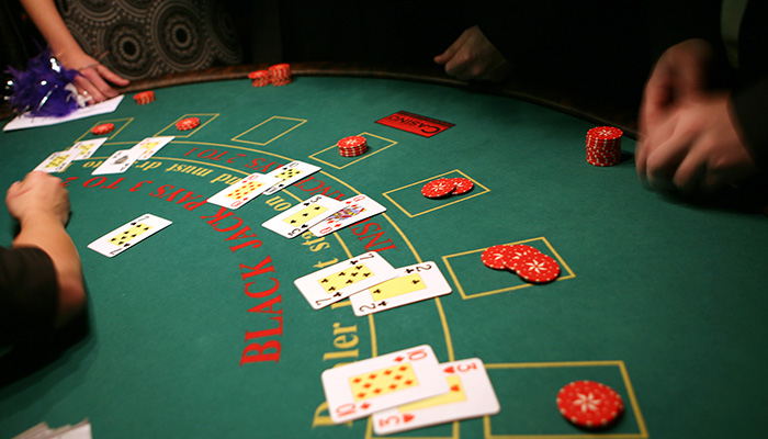 Blackjack Players Sat at Table