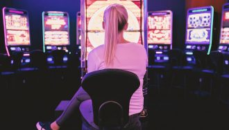 A young woman playing live casino games in a casino