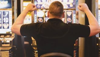 Man playing slot machine