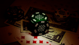 Poker chips, dollar bills, and cards