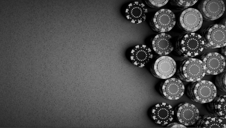 Black and white image of stacks of poker chips