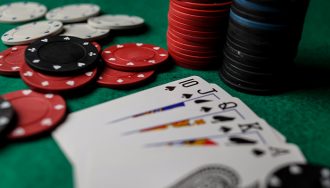 Straight Flush and Chips on Gaming Table