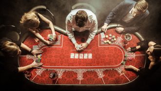 Poker Players Surrounding Gaming Table