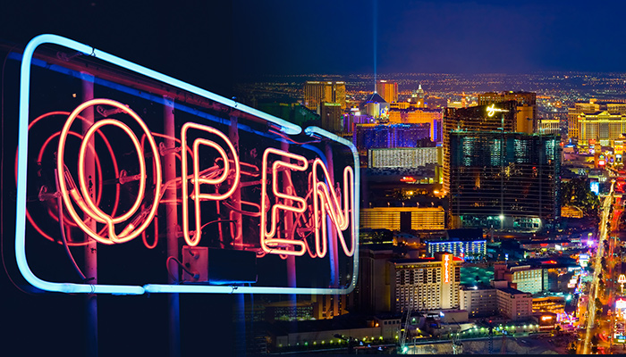 “Open” Sign and Las Vegas Strip by Night as a Background Picture