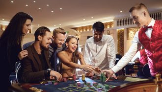 Young Players at a Roulette Table in a Casino