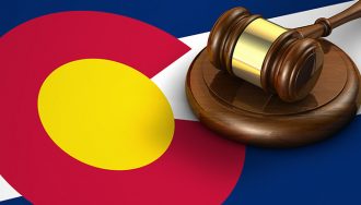 A Gavel over the Colorado State Flag