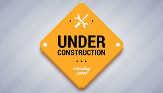 Yellow Sign Saying Under Construction and Coming Soon
