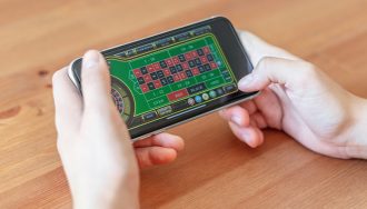 Gambler Using Smartphone to Play Casino Game